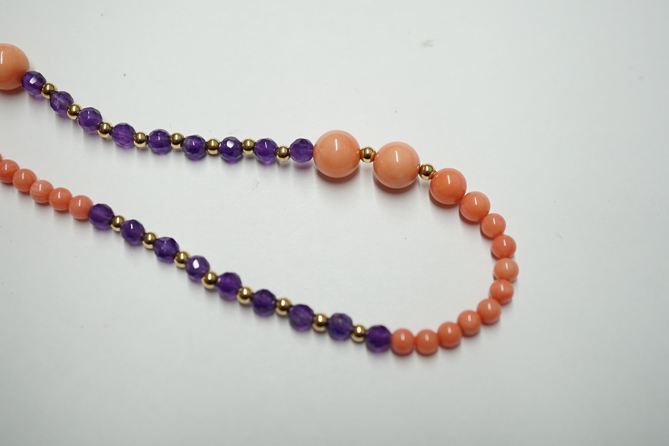 A 9ct amethyst and coral long necklace, 124cm. Condition - fair